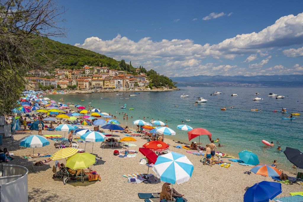 View of beach and the town in the background in MoÅ¡ÄeniÄ?ka Draga, Eastern Istria, Kvarner Bay, Eastern Istria, Croatia, Europe