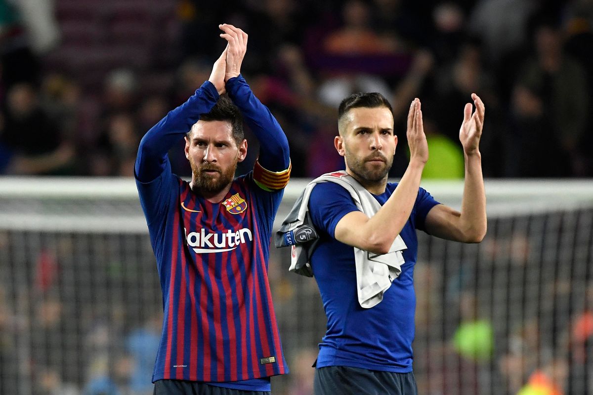 Barcelona's Argentinian forward Lionel Messi (L) and Barcelona's Spanish defender Jordi Alba celebrate at the end of the UEFA Champions League semi-final first leg football match between Barcelona and Liverpool at the Camp Nou Stadium in Barcelona on May 1, 2019. (Photo by LLUIS GENE / AFP)