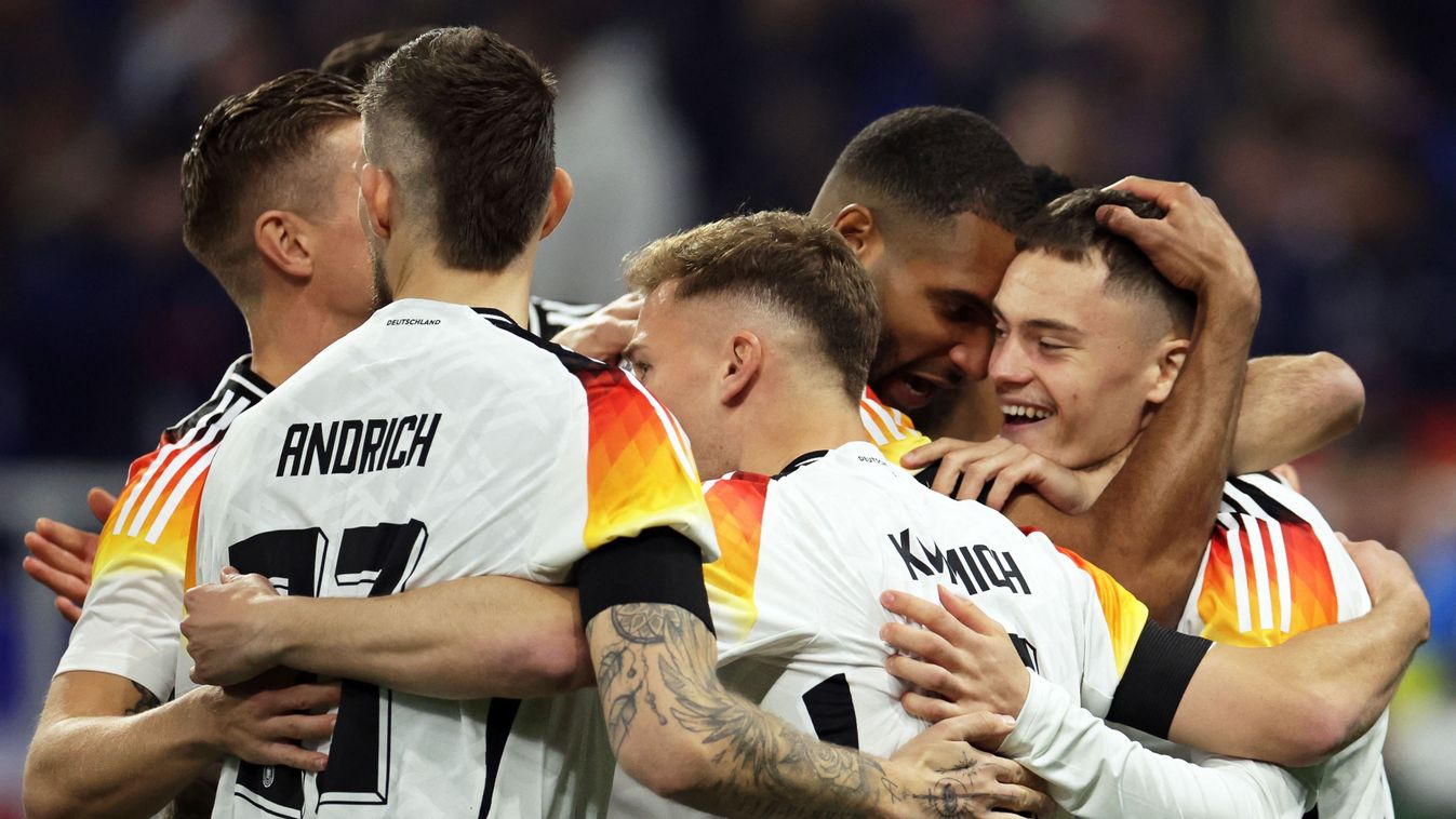 23 March 2024, France, Lyon: Soccer: International match, France - Germany, Groupama Stadium. Germany's Florian Wirtz (r) celebrates his goal for 1:0 with his teammates. Photo: Christian Charisius/dpa (Photo by CHRISTIAN CHARISIUS / DPA / dpa Picture-Alliance via AFP)