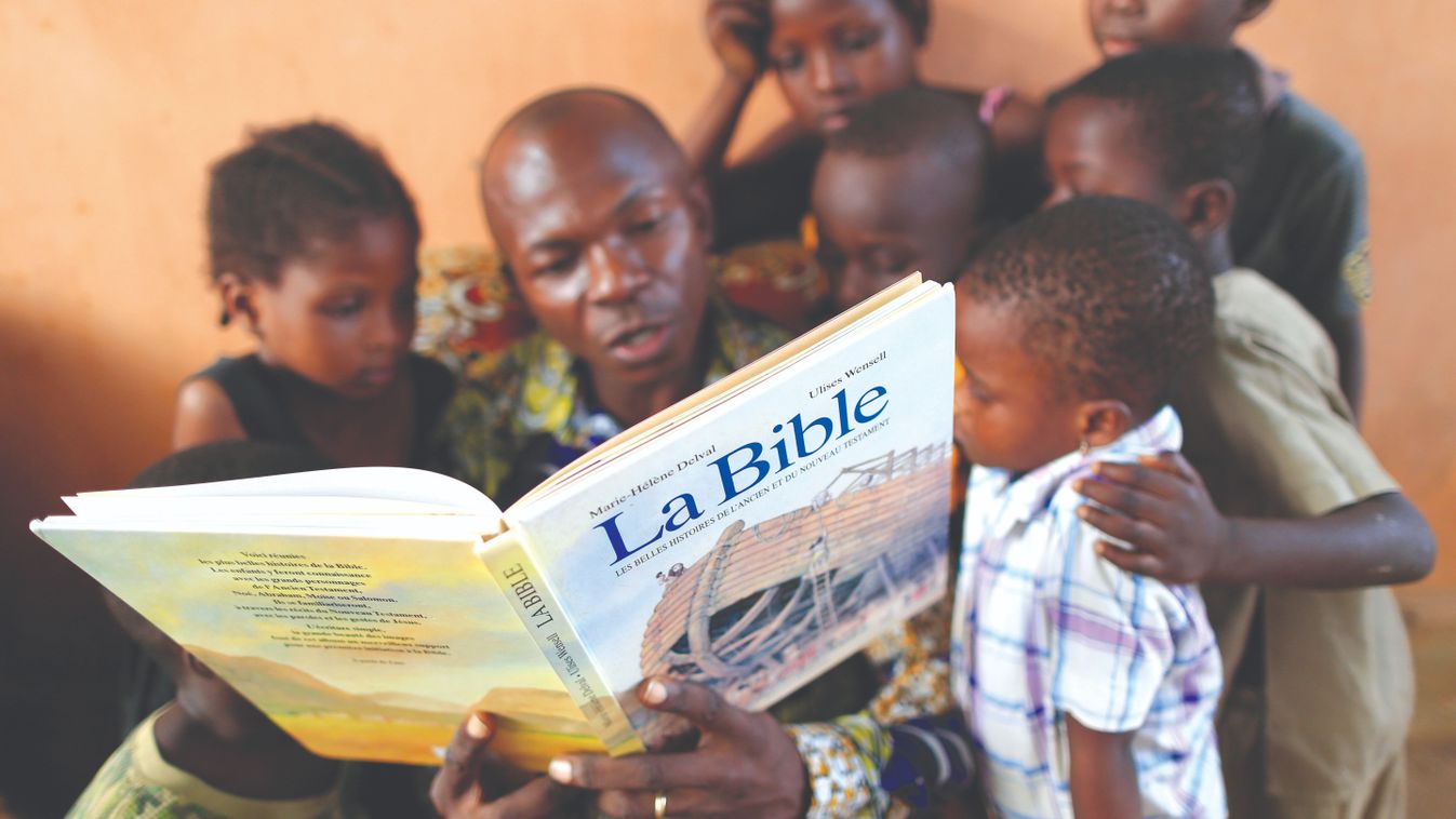 Reading,The,Bible,To,Children,In,Togo.,Catholic,Church.,Togo.