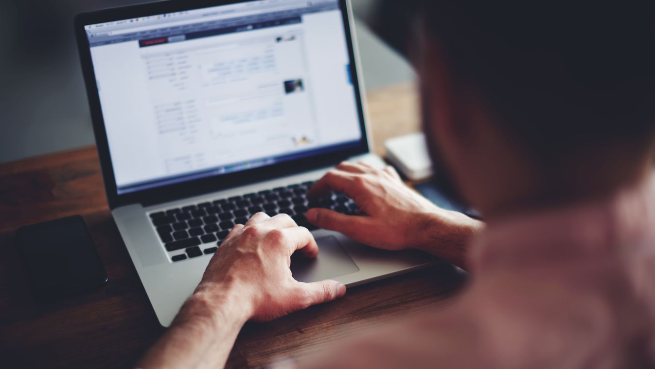 Cropped,Image,Of,A,Young,Man,Working,On,His,Laptop