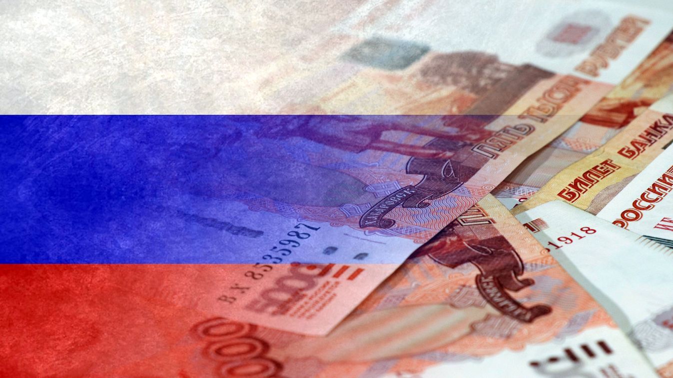 Flag of Russia and Russian rubles in cash