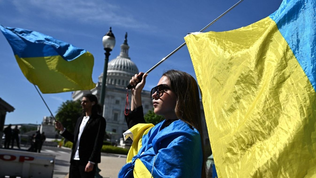 Activists wave Ukrainian flags outside the US Capitol in Washington, DC, on April 23, 2024. The US Senate is due to vote on the final foreign aid package of $95 billion in total military assistance to US allies, including money for Israel and Taiwan alongside the $61 billion earmarked for Ukraine -- is expected to land on President Joe Biden's desk for his approval by the end of the week.
Mandel NGAN / AFP