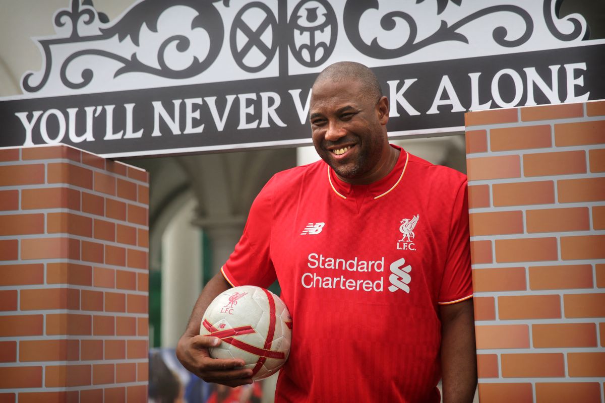 This picture taken on April 17, 2016 shows John Barnes, a former English and Liverpool football player, posing for photographs during a Liverpool FC Soccer Clinic in Hong Kong. England legend John Barnes has questioned the integrity of the Chinese Super League’s recent big-money imports, suggesting they lack the desire to be top-quality footballers. (Photo by ISAAC LAWRENCE / AFP) / To go with AFP story Fbl-Asia-HKG-CHN-Barnes by Daniel Hicks