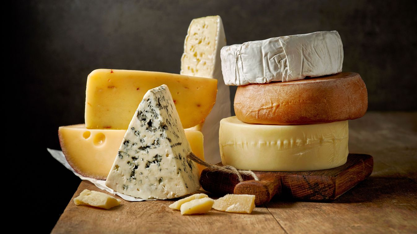 Various,Types,Of,Cheese,On,Rustic,Wooden,Table