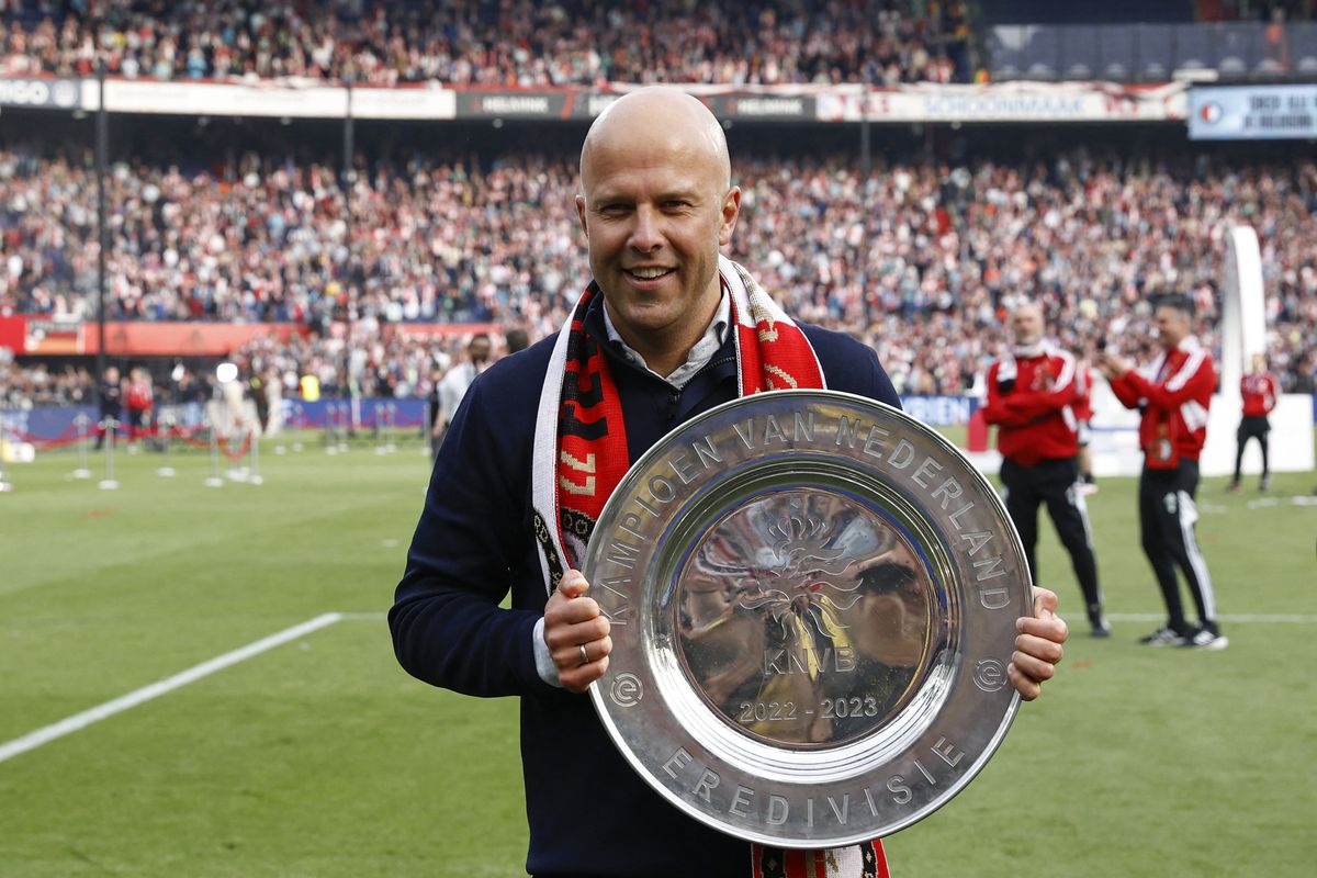 Feyenoord coach Arne Slot celebrates with the championship trophy after winning the Dutch Eredivisie football match between Feyenoord and Go Ahead Eagles (Deventer) and the national championship at the Stadium De Kuip in Rotterdam on May 14, 2023. (Photo by MAURICE VAN STEEN / ANP / AFP) / Netherlands OUT