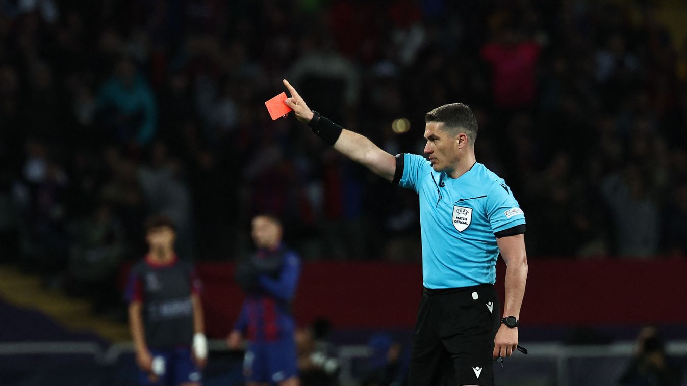 Romanian referee Istvan Kovacs gives a red card to Barcelona's Spanish coach Xavi during the UEFA Champions League quarter-final second leg football match between FC Barcelona and Paris SG at the Estadi Olimpic Lluis Companys in Barcelona on April 16, 2024. (Photo by FRANCK FIFE / AFP)