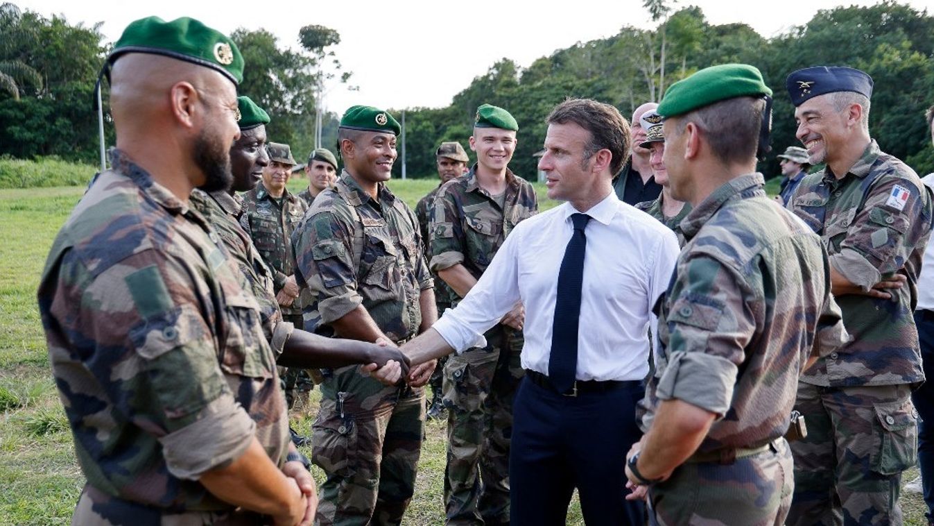 French President Emmanuel Macron (C) meets with members of the 3rd Foreign Infantry Regiment of the French Foreign Legion at the Advanced Operational Base (BAO) in Camopi, as part of a two-day visit to the French overseas department of Guiana, South America, on March 25, 2024.
Ludovic MARIN / AFP