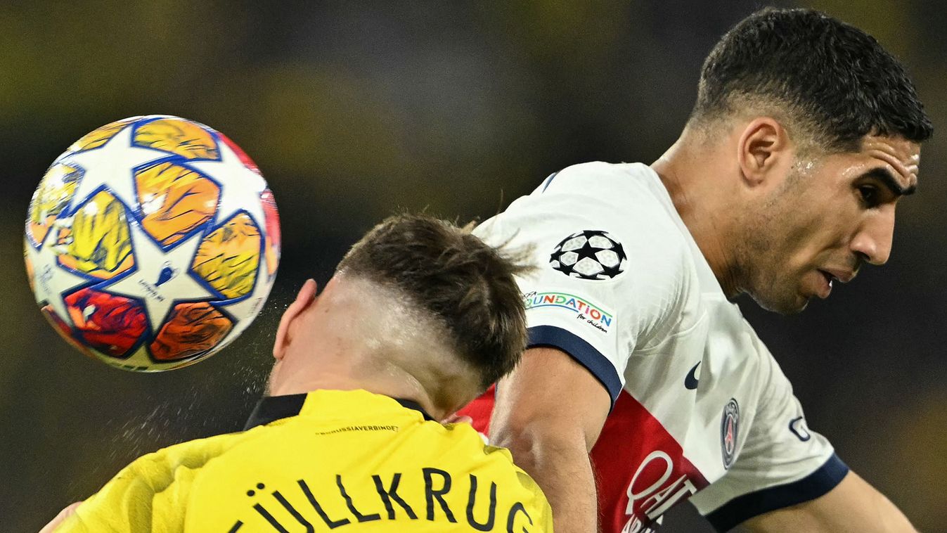 Dortmund's German forward #14 Niclas Fuellkrug heads the ball next to Paris Saint-Germain's Moroccan defender #02 Achraf Hakimi during the UEFA Champions League semi-final first leg football match between Borussia Dortmund and Paris Saint-Germain (PSG) on May 1, 2024 in Dortmund. (Photo by INA FASSBENDER / AFP) / ALTERNATIVE CROP