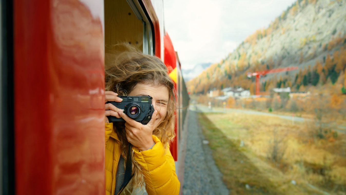 Inspiring,Female,Traveler,And,Travel,Blogger,Look,Out,Of,Window