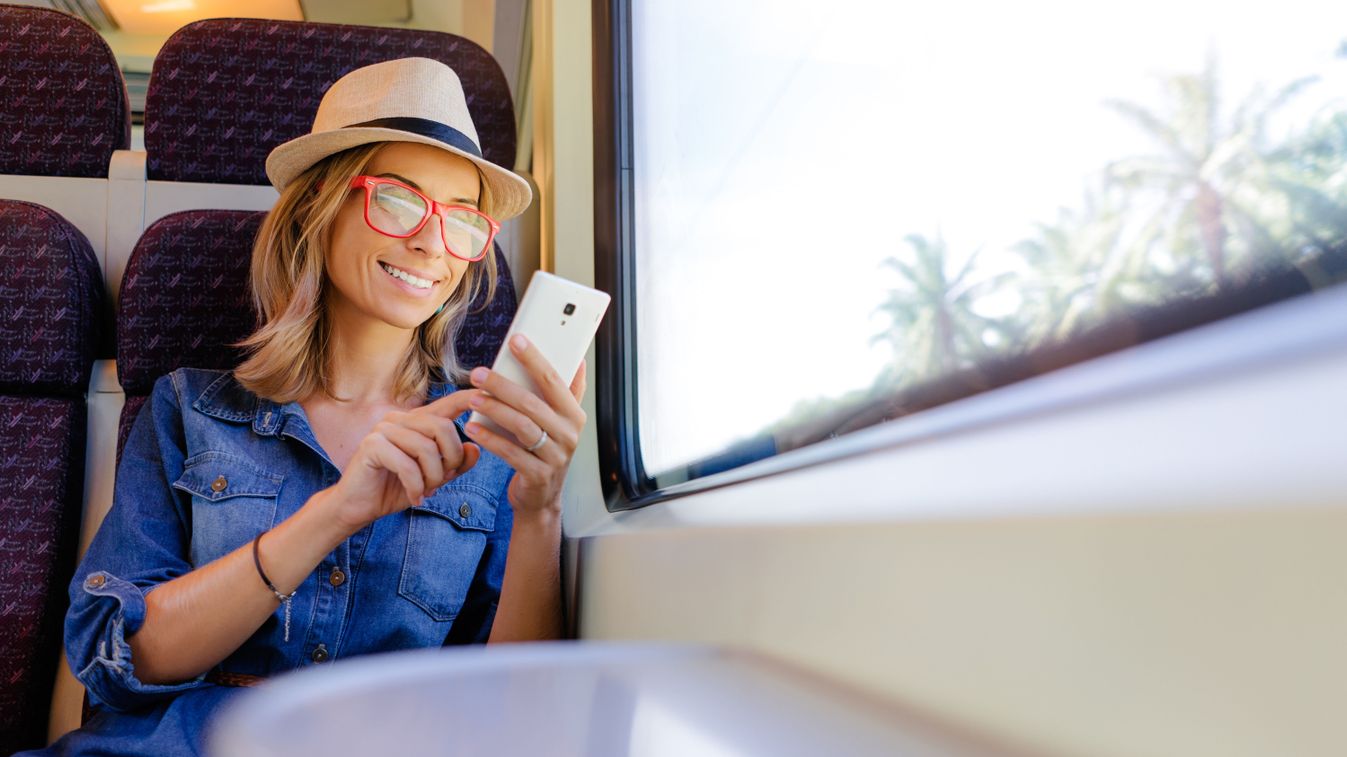 Enjoying,Travel.,Young,Pretty,Woman,Traveling,By,The,Train,Sitting