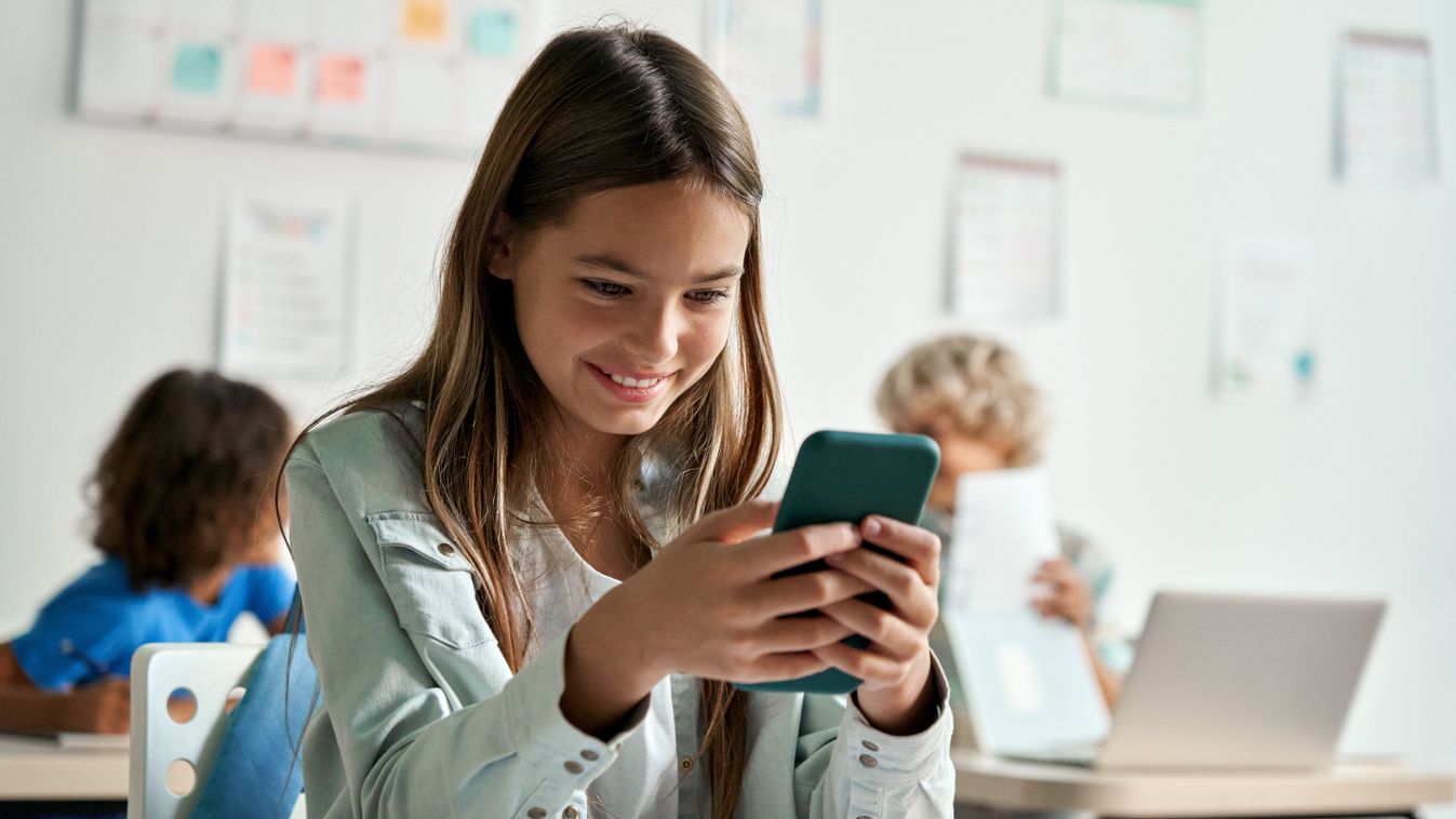 Happy,Latin,Hispanic,Kid,Girl,School,Student,Using,Smartphone,In