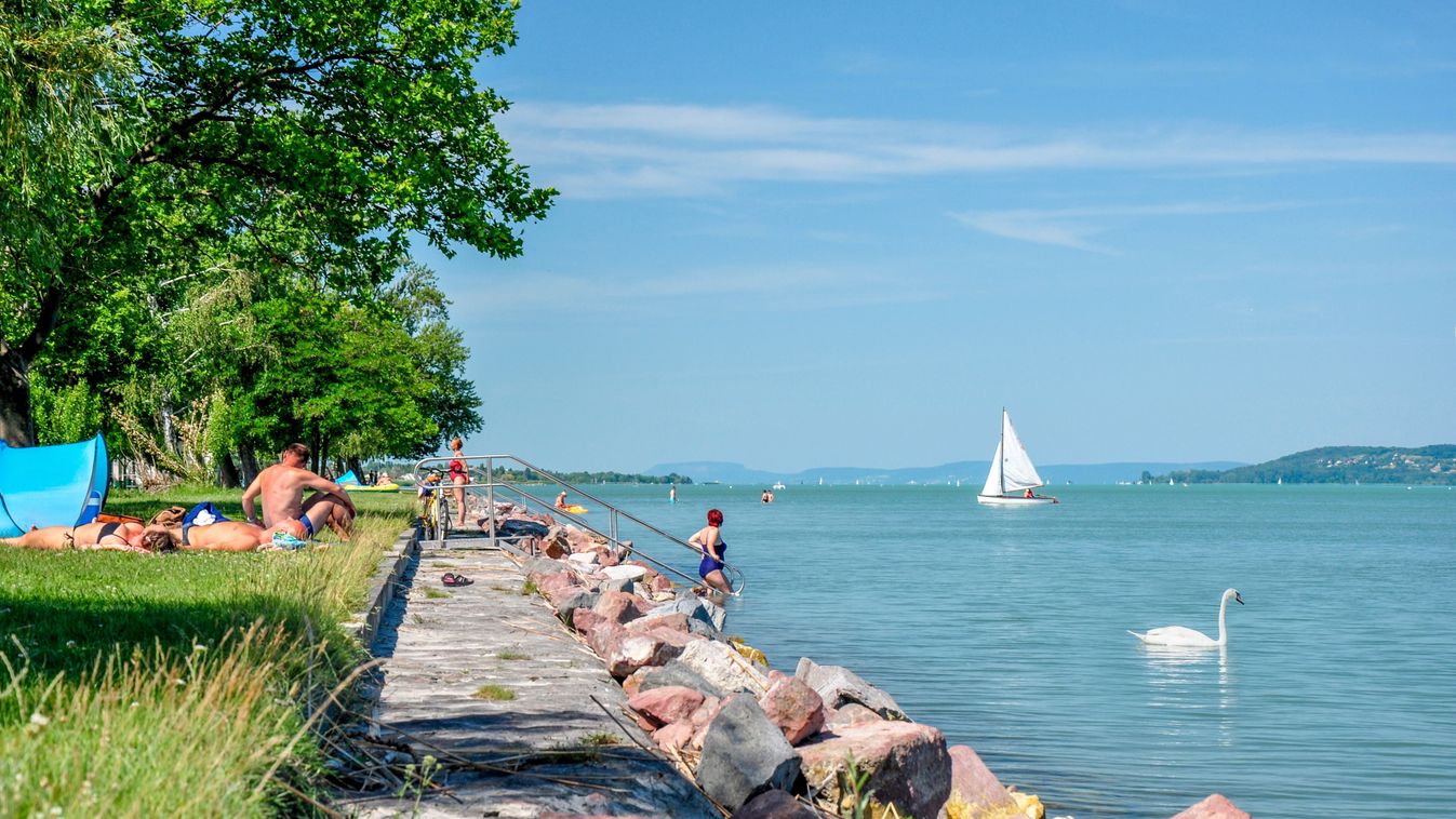 Balatonszéplak,June,19,,2022,A,Few,People,With,Their,Back