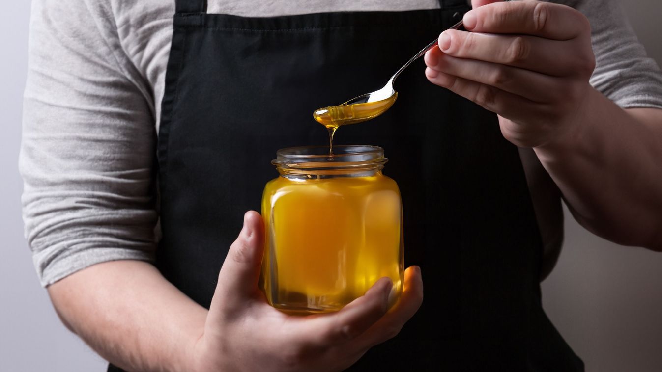 Farmer,Pours,A,Fresh,Harvest,Of,Honey,Into,A,Glass