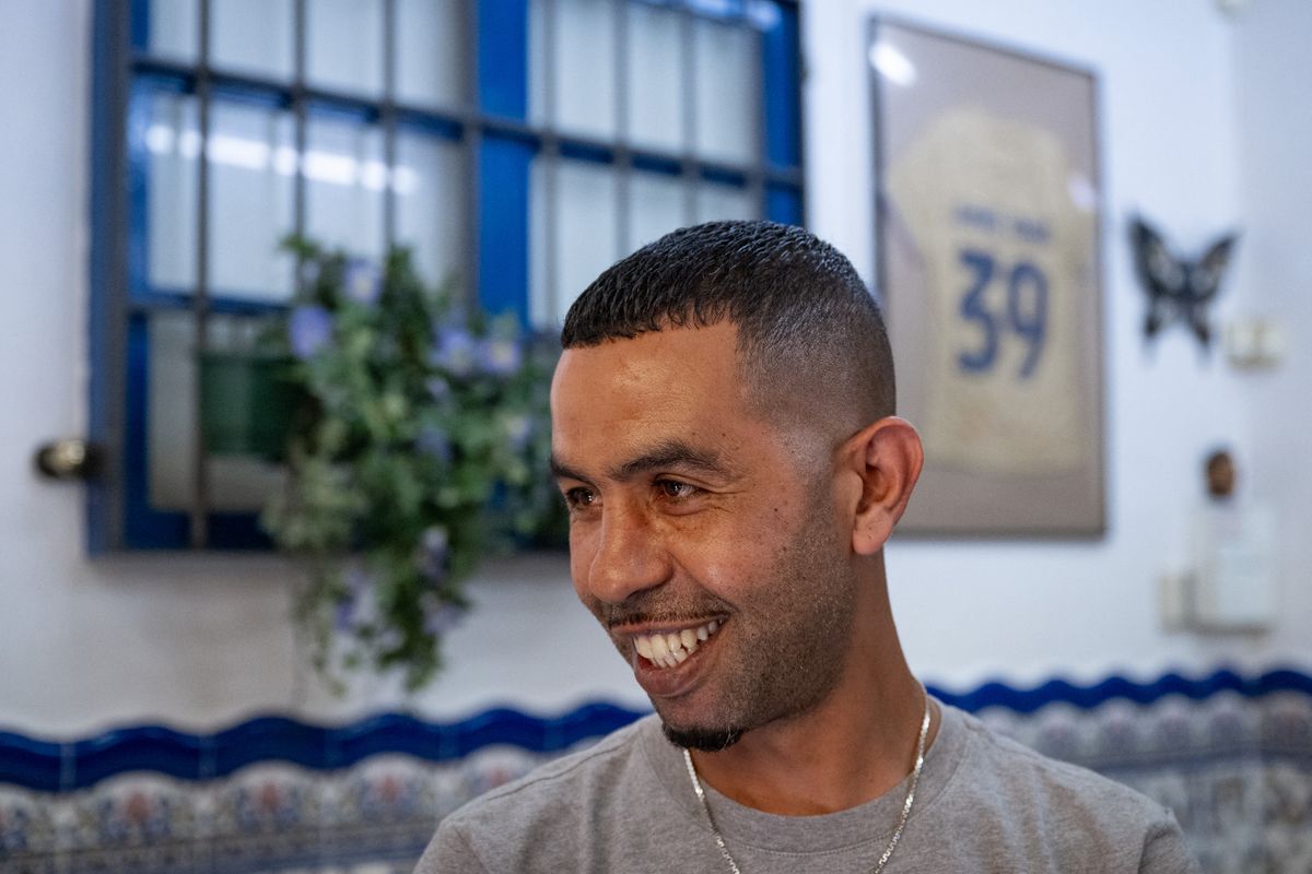 (FILES) Mounir Nasraoui, the father of Spain's forward Lamine Yamal, smiles at 'El Cordobes' bar in Rocafonda, the neighbourhood where his son grew up, in Mataro, 35km from Barcelona, on July 11, 2024. The father of young Spanish football star Lamine Yamal was stabbed on August 14, 2024 in the Catalan town of Mataro and his condition is serious but stable, according to the Spanish newspaper La Vanguardia. 