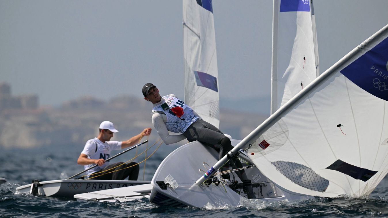 Hungary's Jonatan Vadnai flips over in the medal race of the Men’s ILCA 7 single-handed dinghy event during the Paris 2024 Olympic Games sailing competition at the Roucas-Blanc Marina in Marseille on August 7, 2024. 