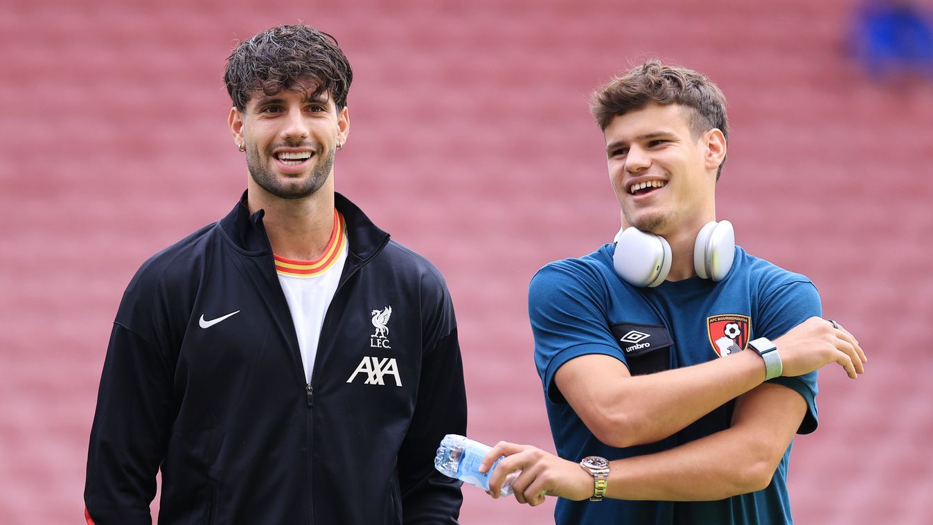 LIVERPOOL, ENGLAND - SEPTEMBER 21: Dominik Szoboszlai of Liverpool talks to Milos Kerkez of Bournemouth before the Premier League match between Liverpool FC and AFC Bournemouth at Anfield on September 21, 2024 in Liverpool, England. 