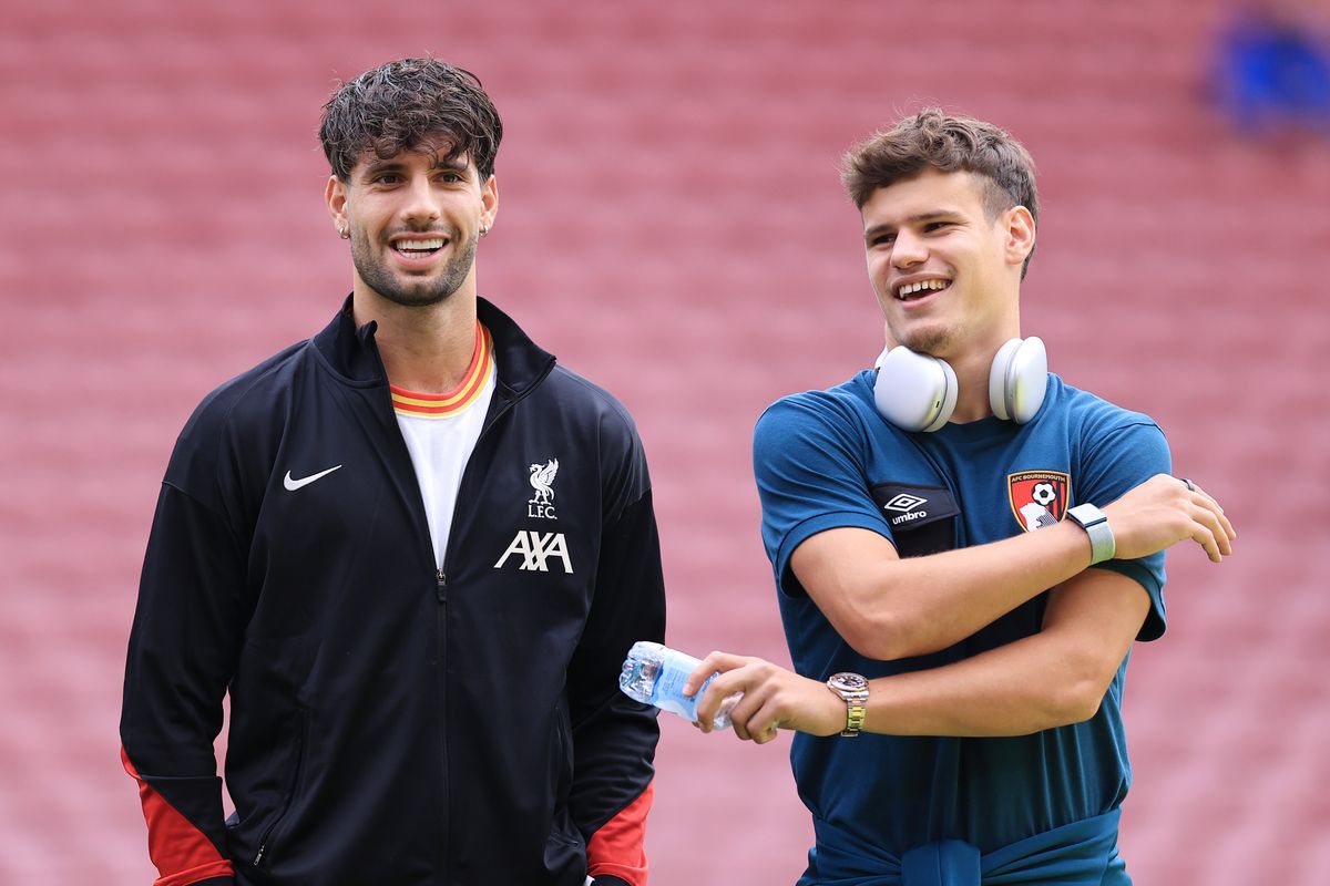 LIVERPOOL, ENGLAND - SEPTEMBER 21: Dominik Szoboszlai of Liverpool talks to Milos Kerkez of Bournemouth before the Premier League match between Liverpool FC and AFC Bournemouth at Anfield on September 21, 2024 in Liverpool, England. 