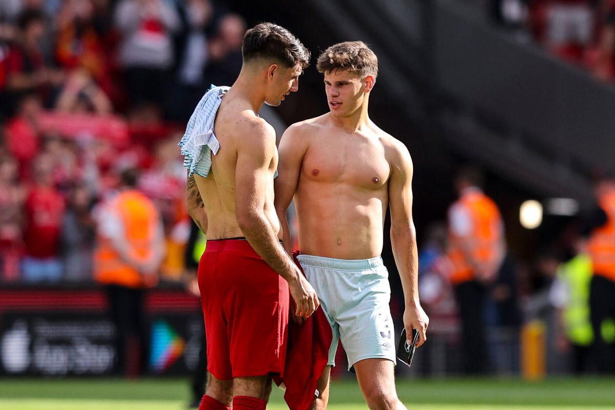 LIVERPOOL, ENGLAND - AUGUST 19: Milos Kerkez of Bournemouth with Dominik Szoboszlai of Liverpool after their sides 3-1 win during the Premier League match between Liverpool FC and AFC Bournemouth at Anfield on August 19, 2023 in Liverpool, England. 