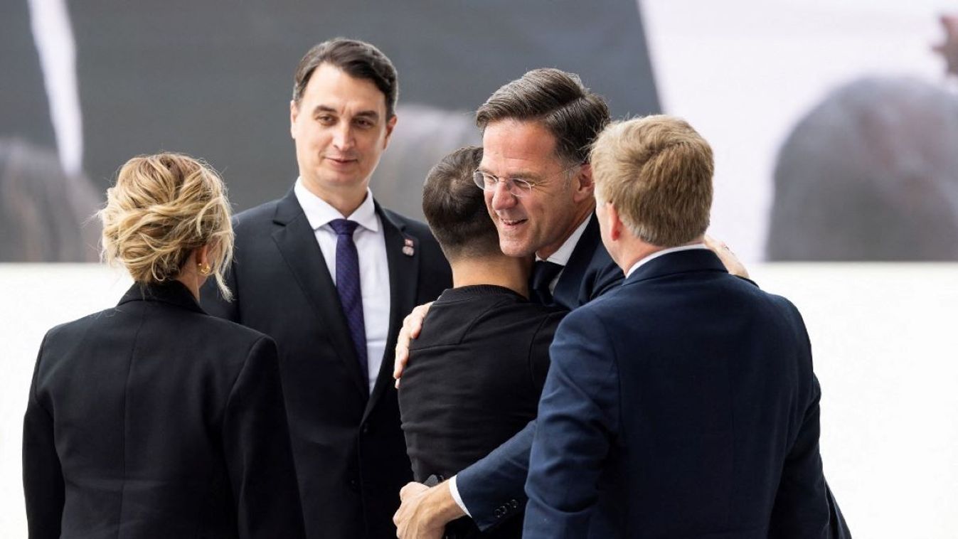 Dutch Prime Minister Mark Rutte (2nd R), Ukrainian President Volodymyr Zelenskyy (3rd L) and First Lady Olena Zelenska (L) take part in the official international ceremony commemorating the 80th anniversary of the Allied landings at the Omaha Beach Memorial in Normandy, France on June 6, 2024.