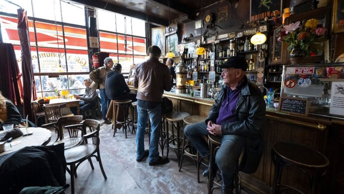 People sit inside the Cafe ’t Monumentje in the De Jordaan district, in Amsterdam on October 23, 2024, as the city launches its 750th anniversary celebrations.