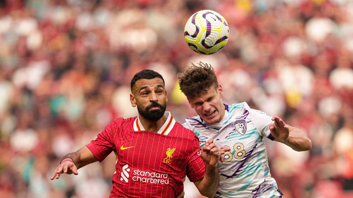 Liverpool's Mohamed Salah battles with Milos Kerkez of AFC Bournemouth during the Premier League match between Liverpool and Bournemouth at Anfield in Liverpool, England, on September 21, 2024. 