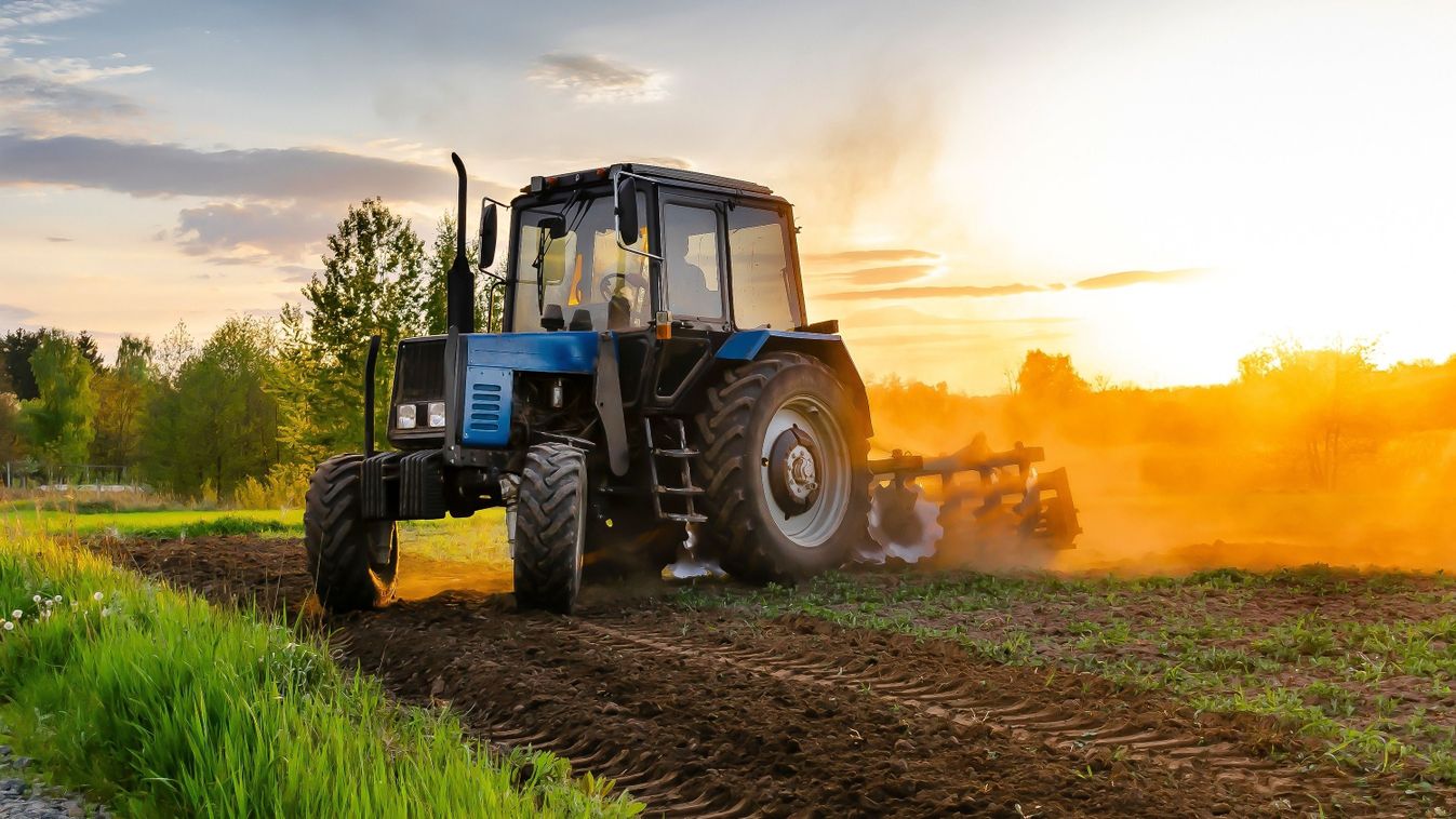 Modern,Blue,Tractor,Machinery,Plowing,Agricultural,Field,Meadow,At,Farm