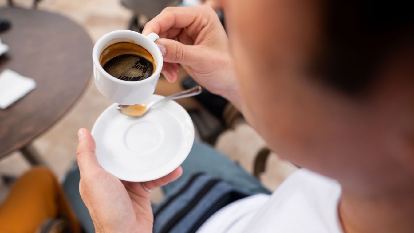 Close-up,Shot,Of,A,Person,Holding,A,Cup,Of,Espresso