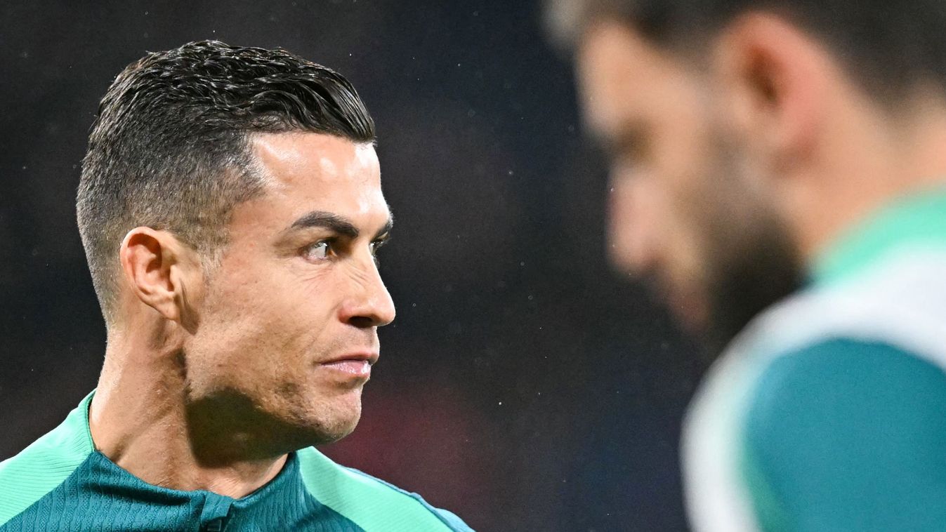 Portugal's forward #07 Cristiano Ronaldo reacts as he warms up during the UEFA Nations League, League A Group A1 football match between Scotland and Portugal at Hampden Park Stadium in Glasgow, on October 15, 2024. 