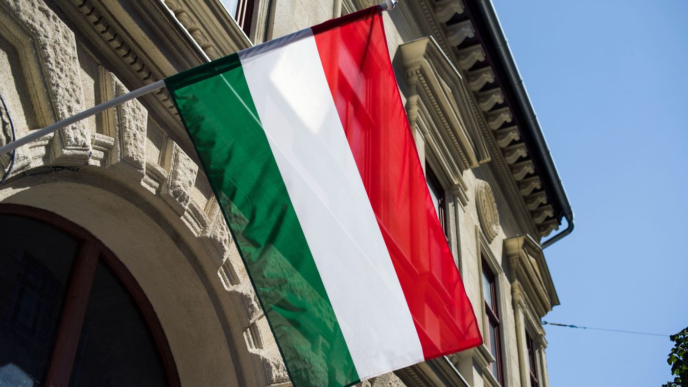 The Hungarian national flag waves on a building in Budapest