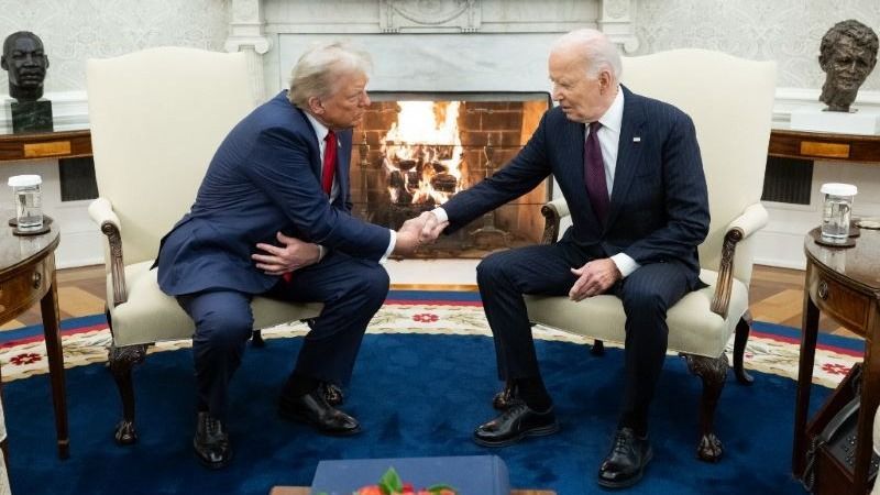 US President Joe Biden shakes hands with US President-elect Donald Trump during a meeting in the Oval Office of the White House in Washington, DC, on November 13, 2024.