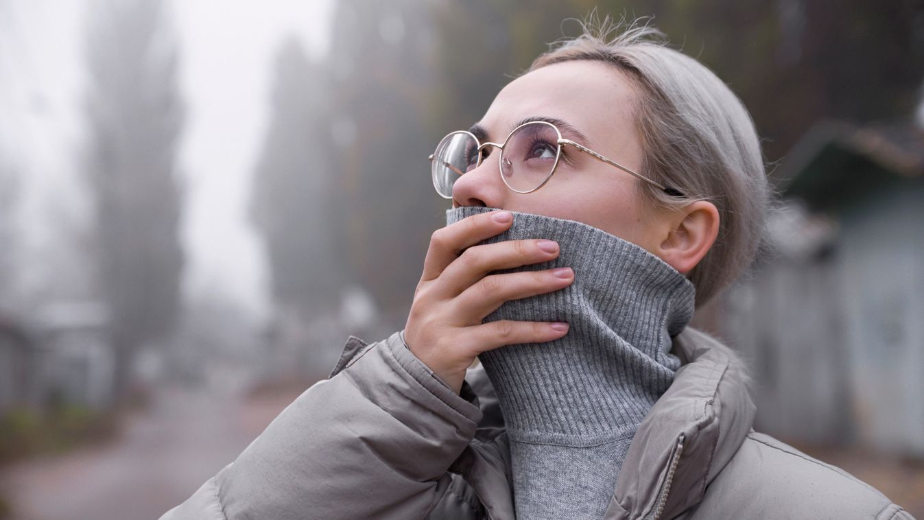 Woman,Hiding,Her,Face,Because,Of,Polluted,Air