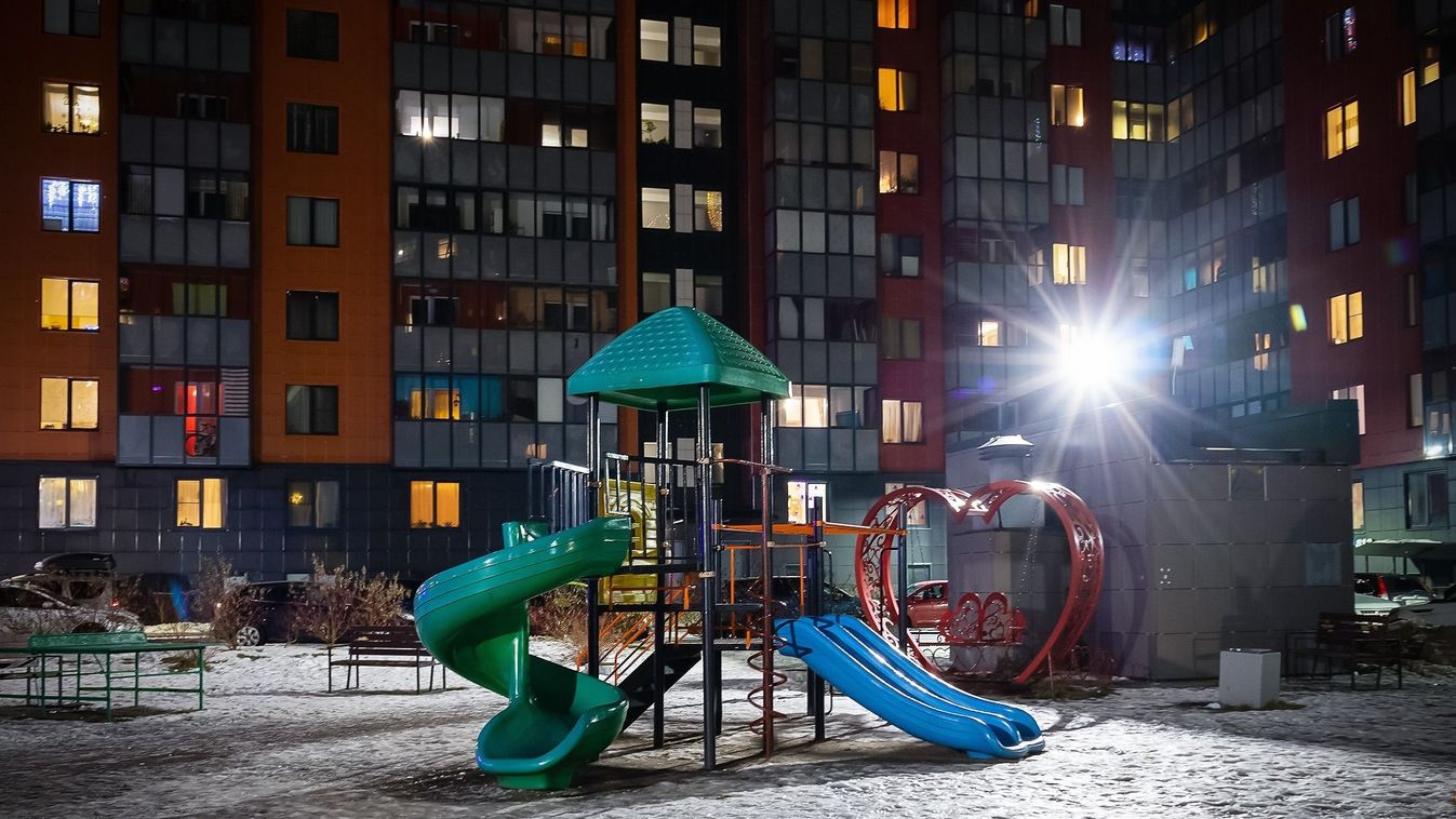 Playground,Snow-covered,Near,A,Large,Multi-storey,Building,At,Night