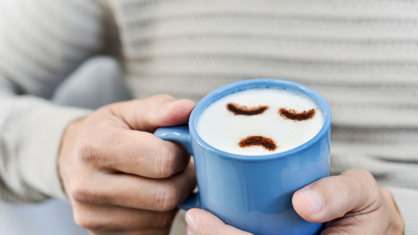 Closeup,A,Young,Caucasian,Man,With,A,Blue,Cup,Of