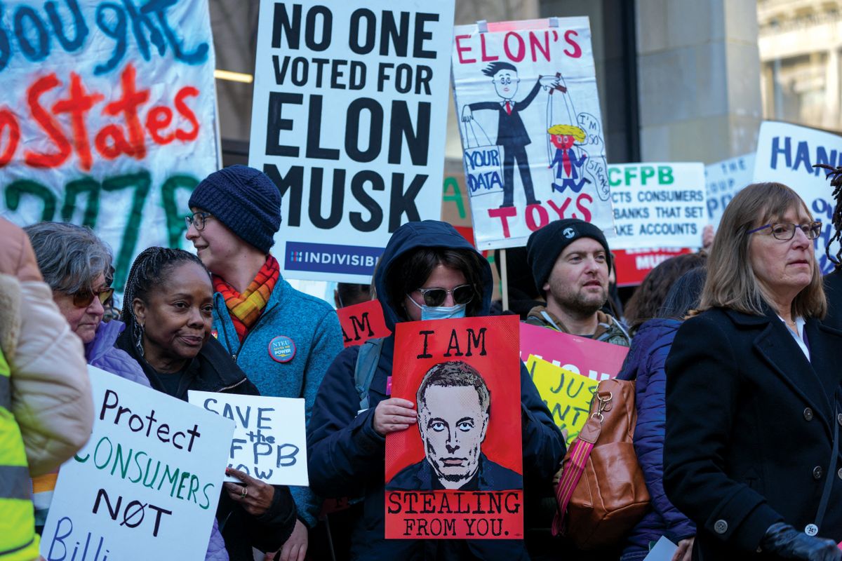 Protesters Gathers At The Consumer Financial Protection Bureau Headquarters To Protest Against Elon Musk And President Donald Trump’s Efforts To Close The Bureau.