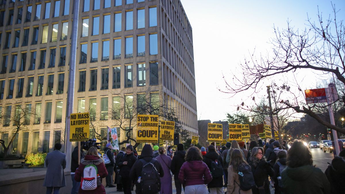 Demonstrators gather outside of the Office of Personnel Management in Washington, D.C. on February 7, 2025 to protest federal layoffs and demand the termination of Elon Musk from the Department of Government Efficiency (DOGE)