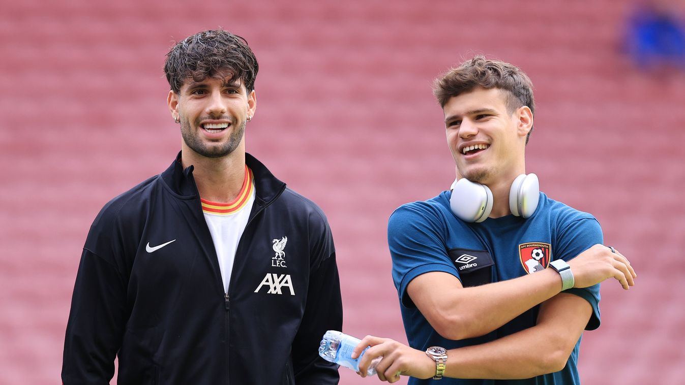 LIVERPOOL, ENGLAND - SEPTEMBER 21: Dominik Szoboszlai of Liverpool talks to Milos Kerkez of Bournemouth before the Premier League match between Liverpool FC and AFC Bournemouth at Anfield on September 21, 2024 in Liverpool, England.   