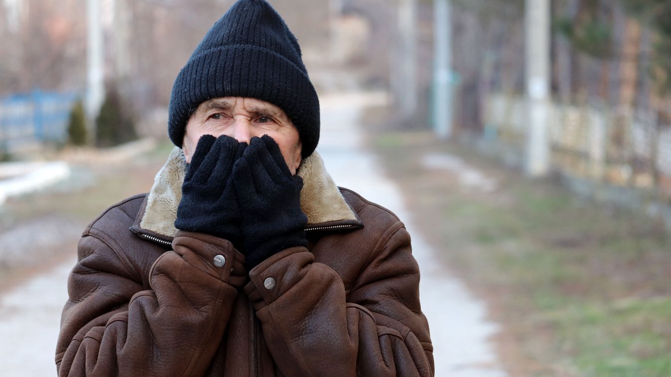 Elderly,Man,Standing,On,The,Rural,Street,And,Warms,Up