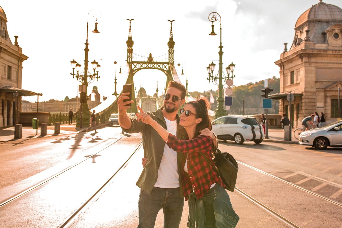 A,Happy,Couple,Taking,A,Selfie,In,Front,Of,The