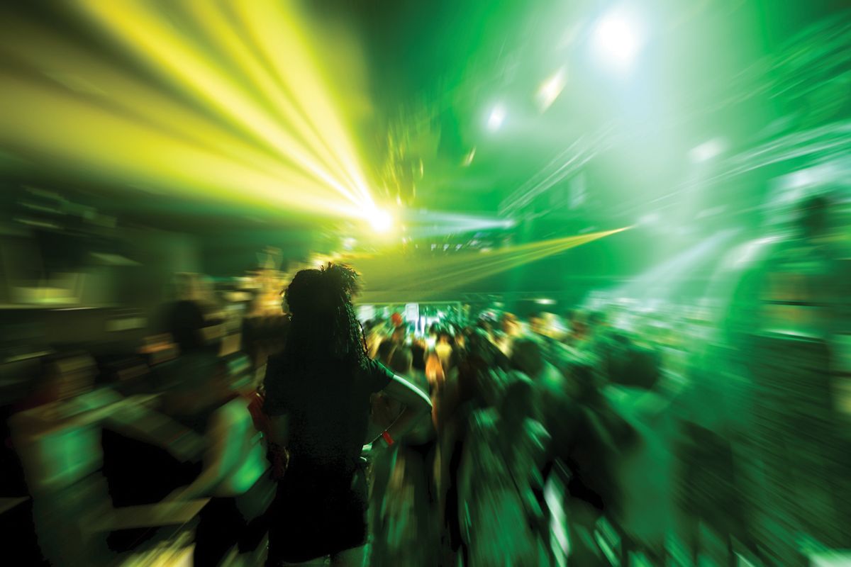 Young,People,Dancing,In,Night,Disco,Club,With,Color,Laser