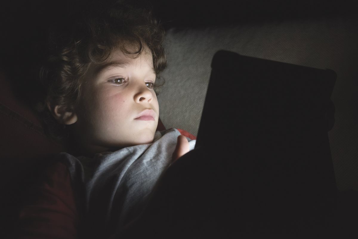 Night,Life.,European,6-year-old,Boy,Lying,On,The,Couch,At